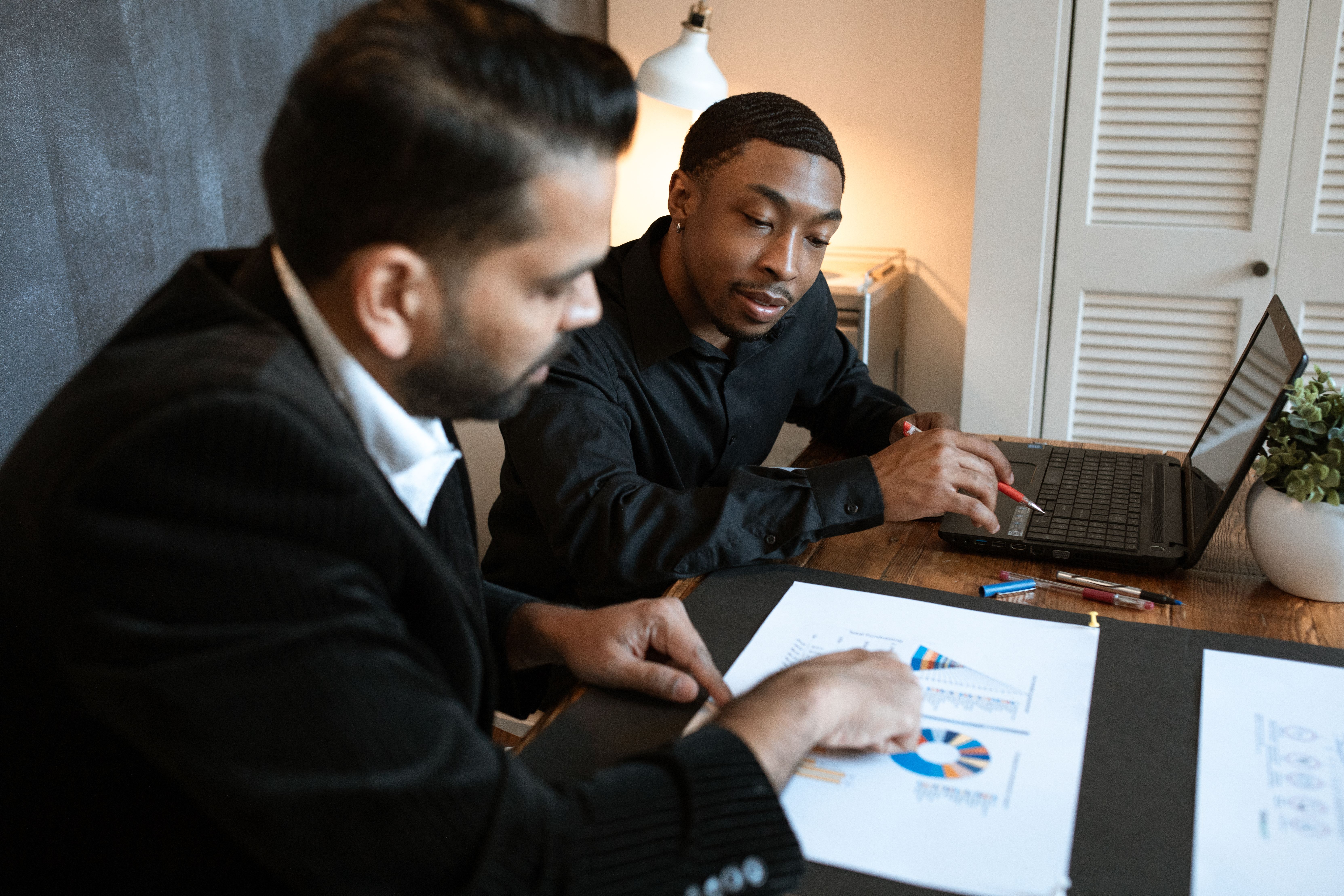 Financial professionals reviewing data