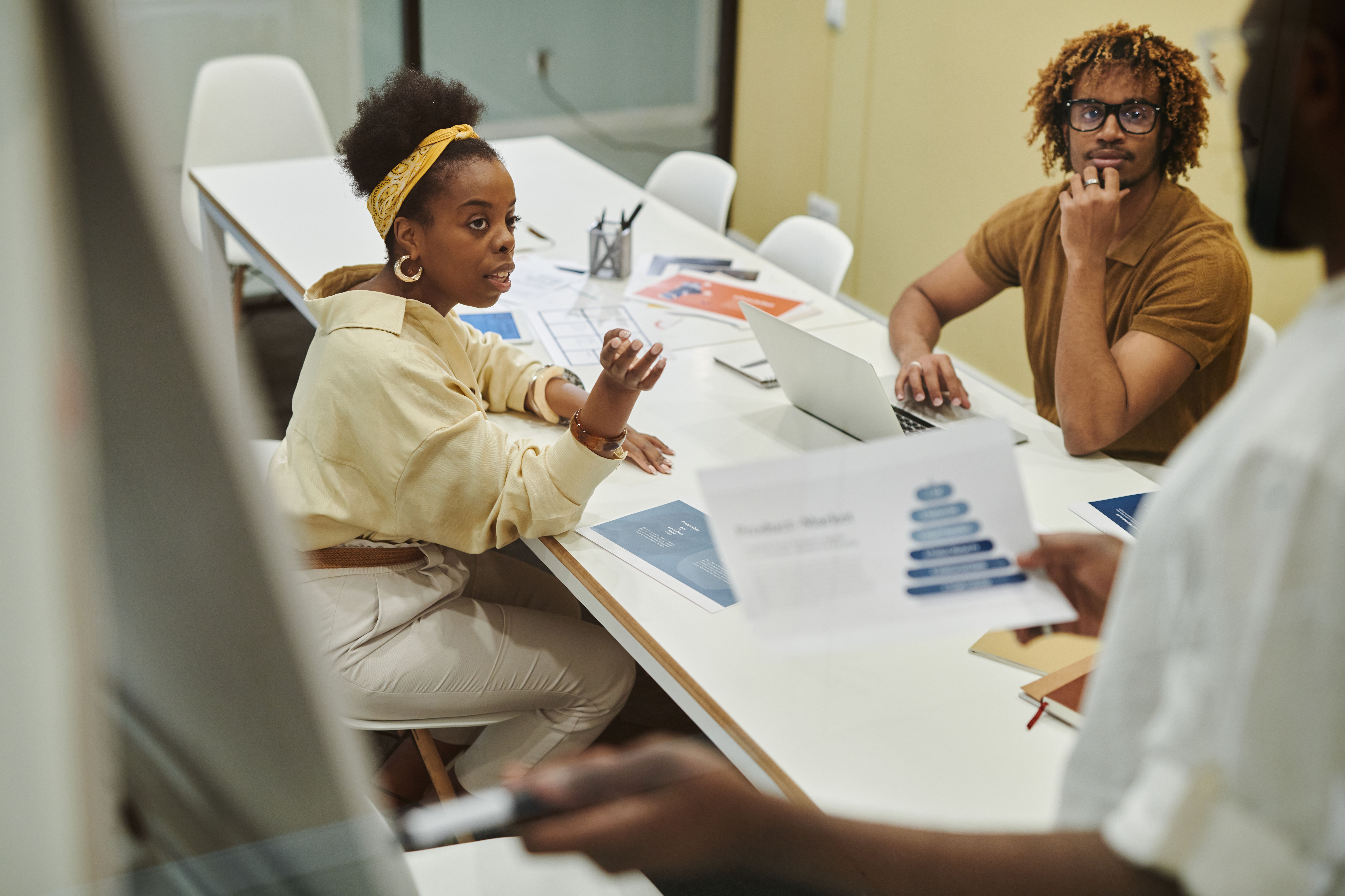 Consultant discussing financial plans with clients